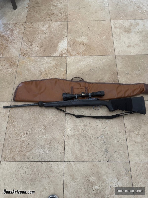 375 H&H Mag with 3-10 Simmons Scope.