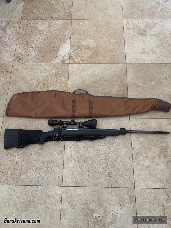 375 H&H Mag with 3-10 Simmons Scope.