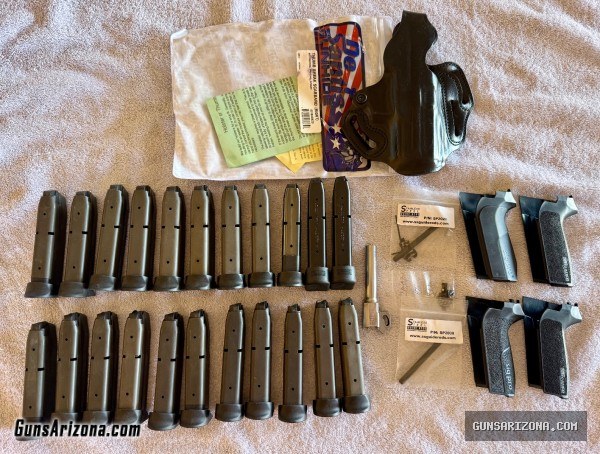 TWO Sig Sauer SP2022 pistols with lots of extras