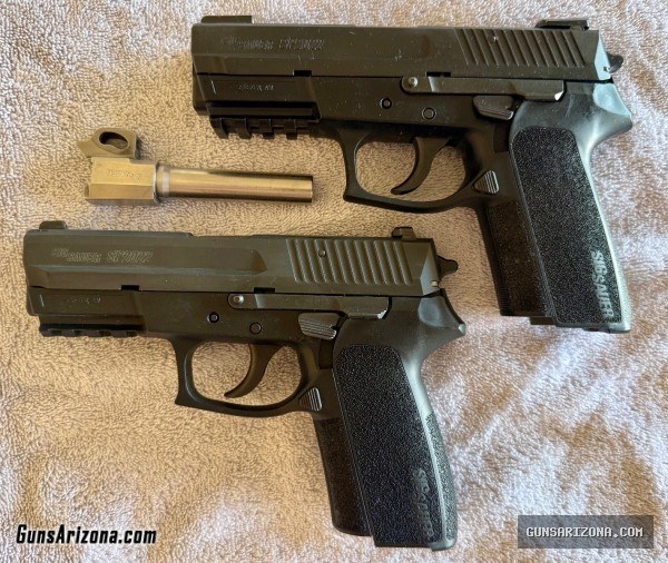 TWO Sig Sauer SP2022 pistols with lots of extras